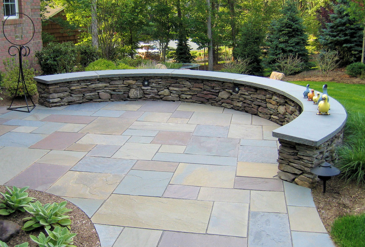 bluestone patio with curved seat wall
