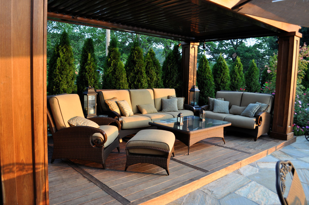 patio furniture in pergola with arborvitae for privacy - nj