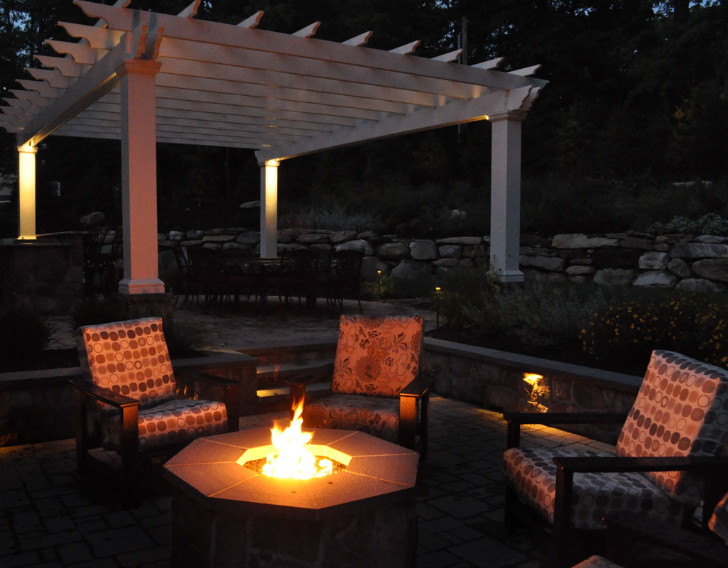 fire pit and pergola with uplighting
