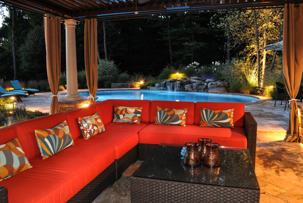 pool landscaping illuminated with landscape lighting