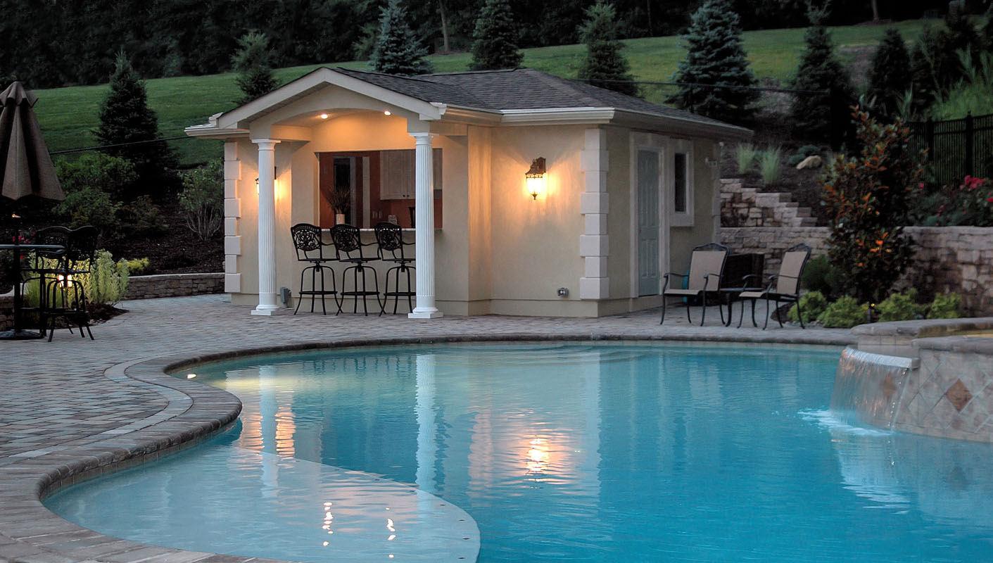 pool house with outdoor lighting