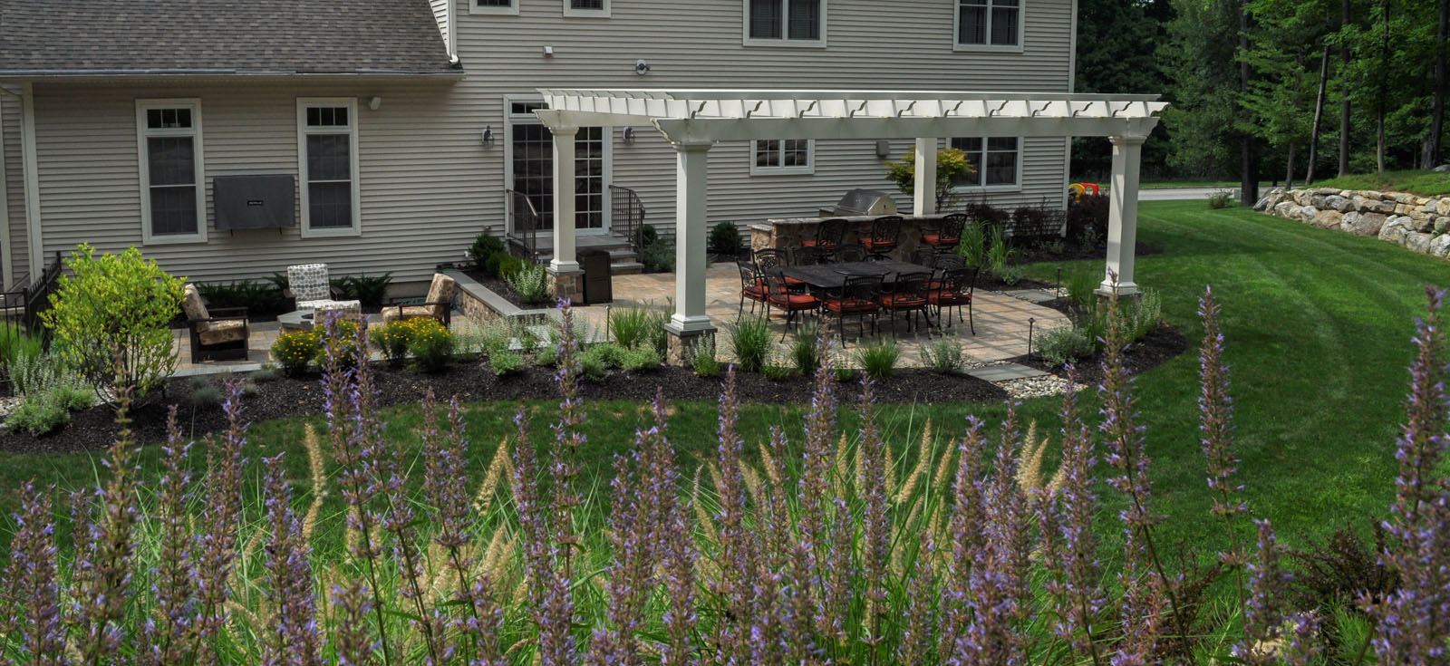 before and after landscaping photo, after photo, patio with pergola and fire pit - north jersey