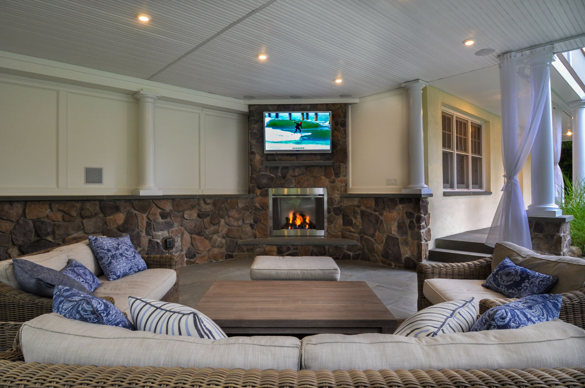 outdoor living room with veneer stone, gas fireplace 