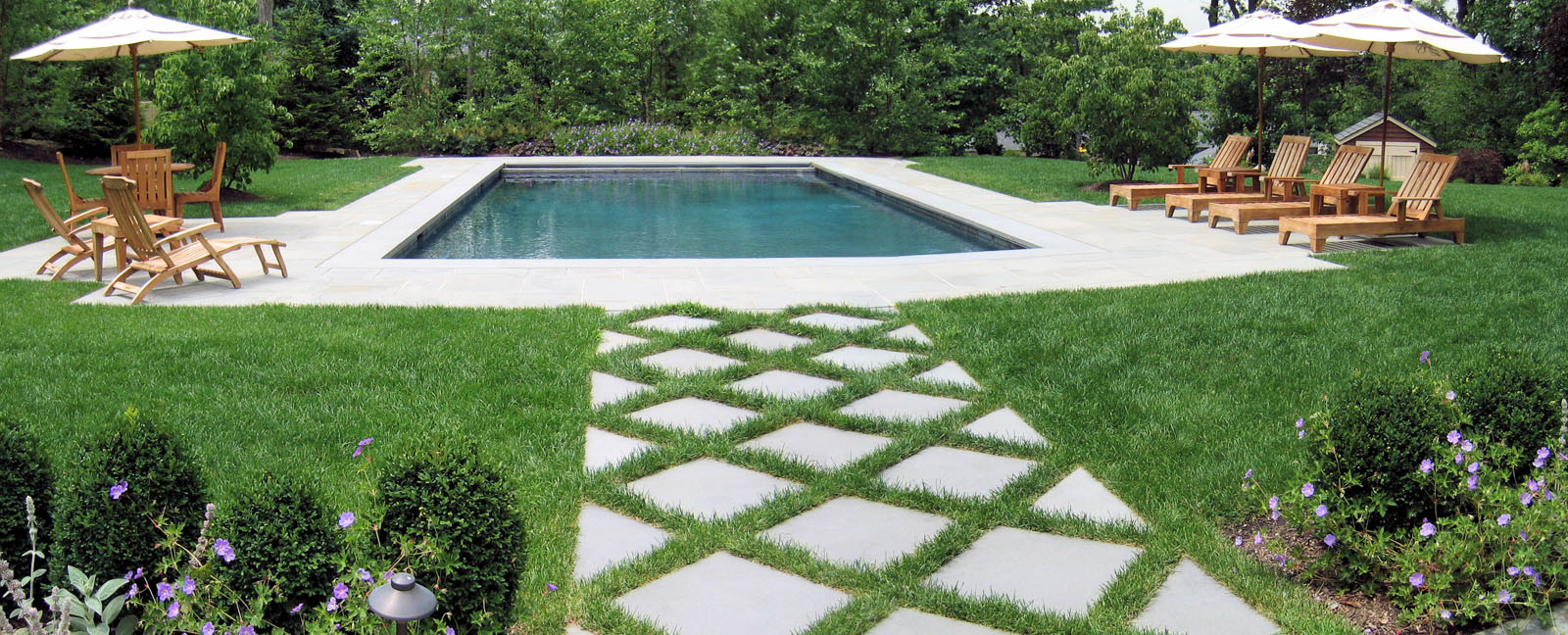 rectangular new jersey swimming pool with two seating areas