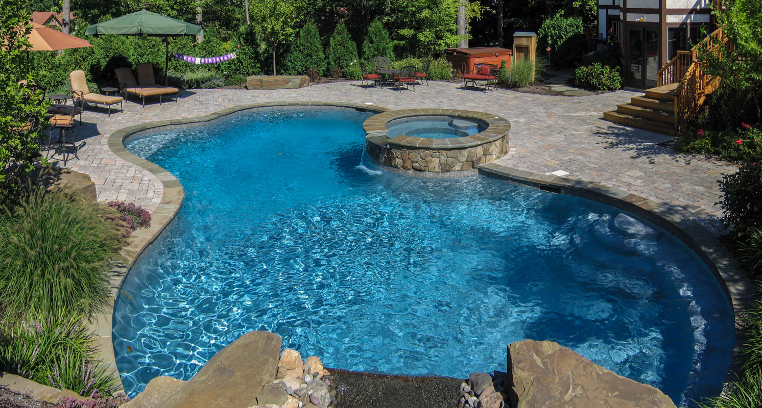 custom designed swimming pool with round spa