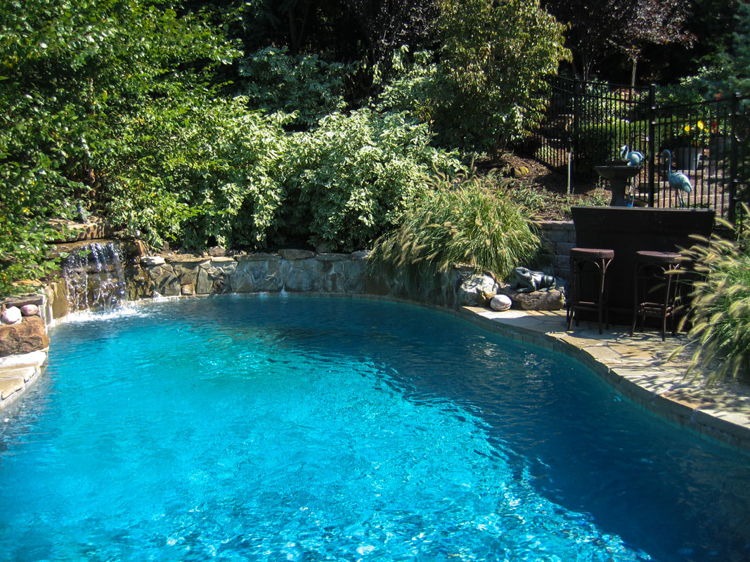 custom swimming pool with pool waterfall