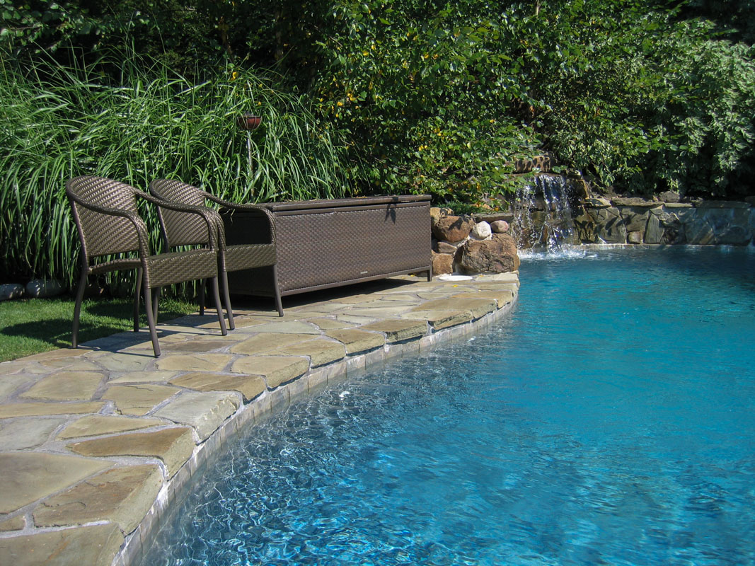 custom swimming pool, patio, and pool waterfall