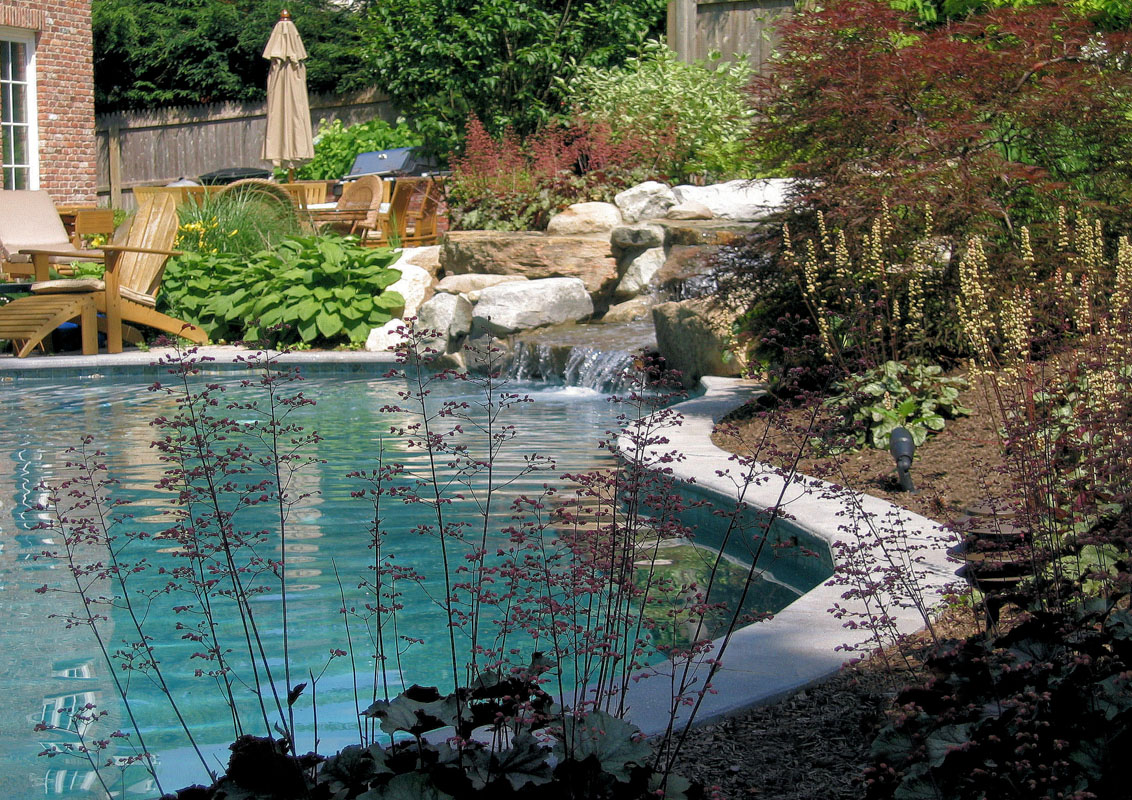 swimming pool with natural stone waterfall
