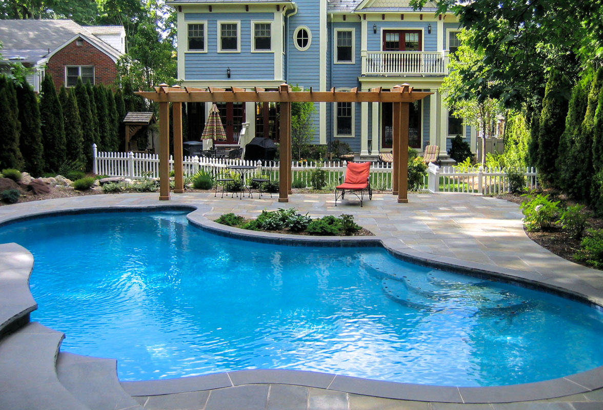 custom swimming pool design with pergola on pool patio