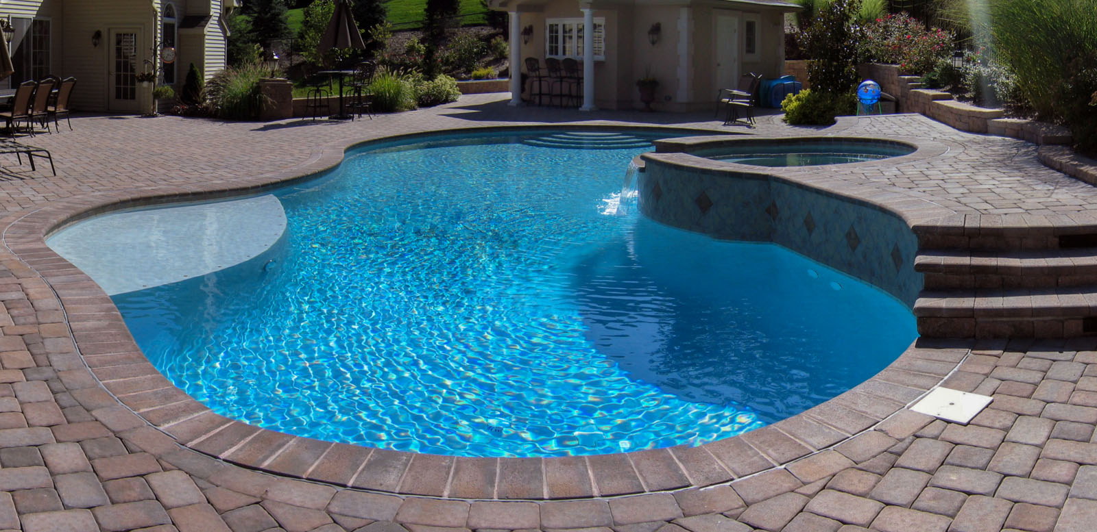 nj swimming pool design with upper level spa and pool house
