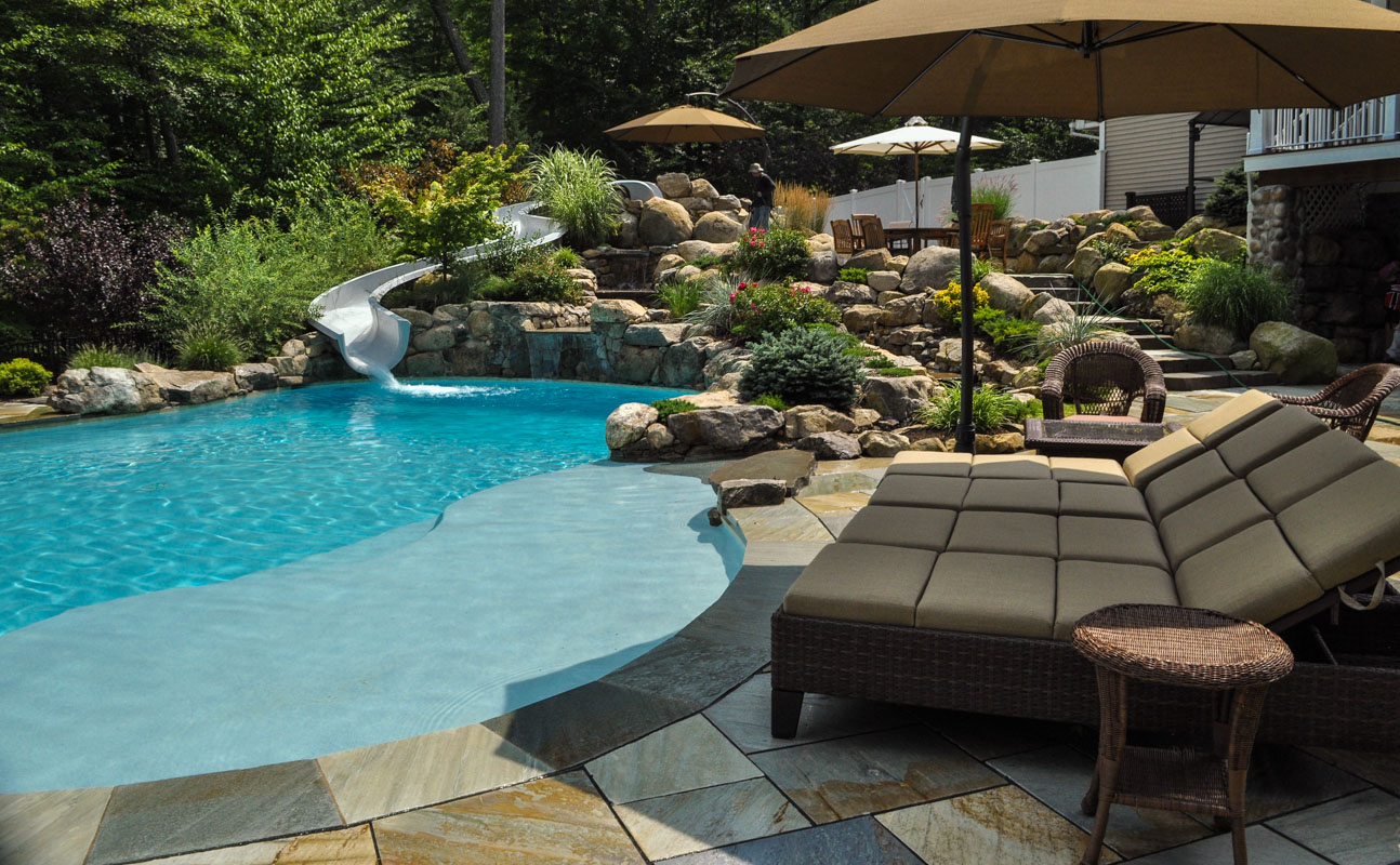 swimming pool with custom pool waterslide