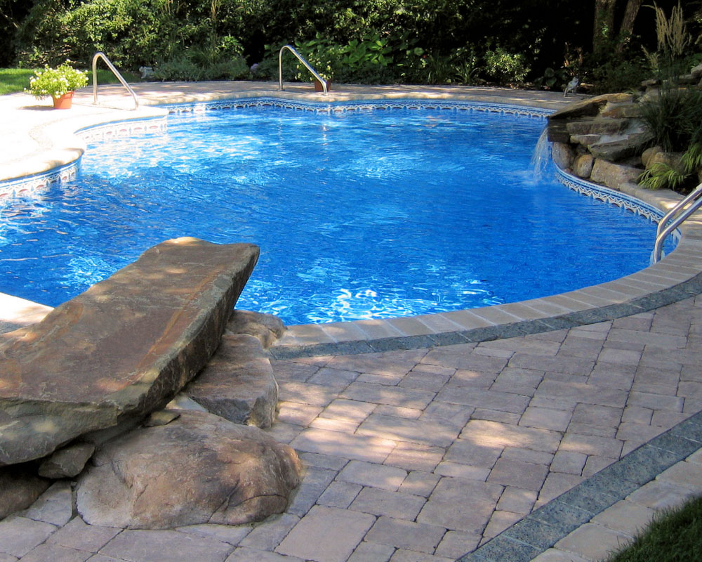 north jersey custom swimming pool with dive rock and pool waterfall