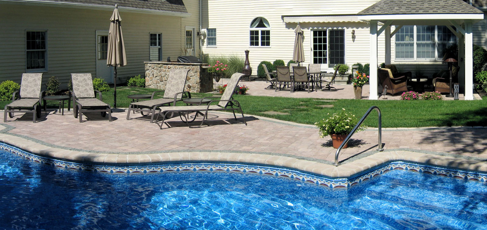 swimming pool with paver patio