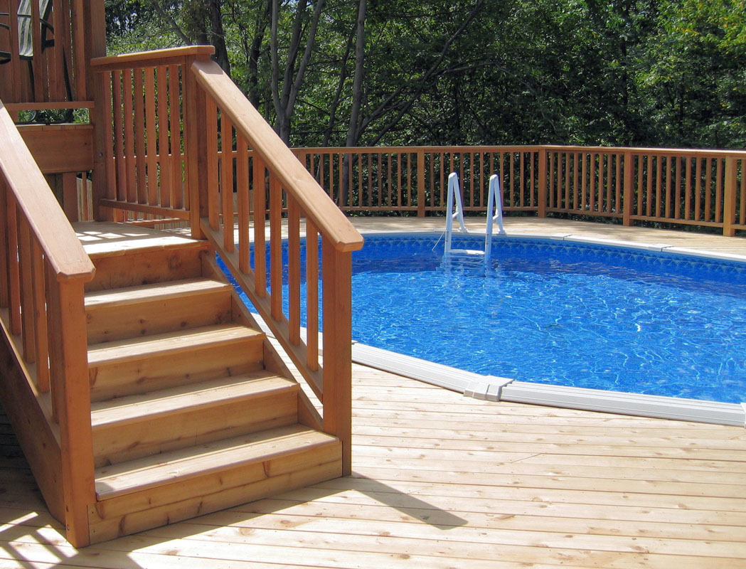 above ground swimming pool built into deck