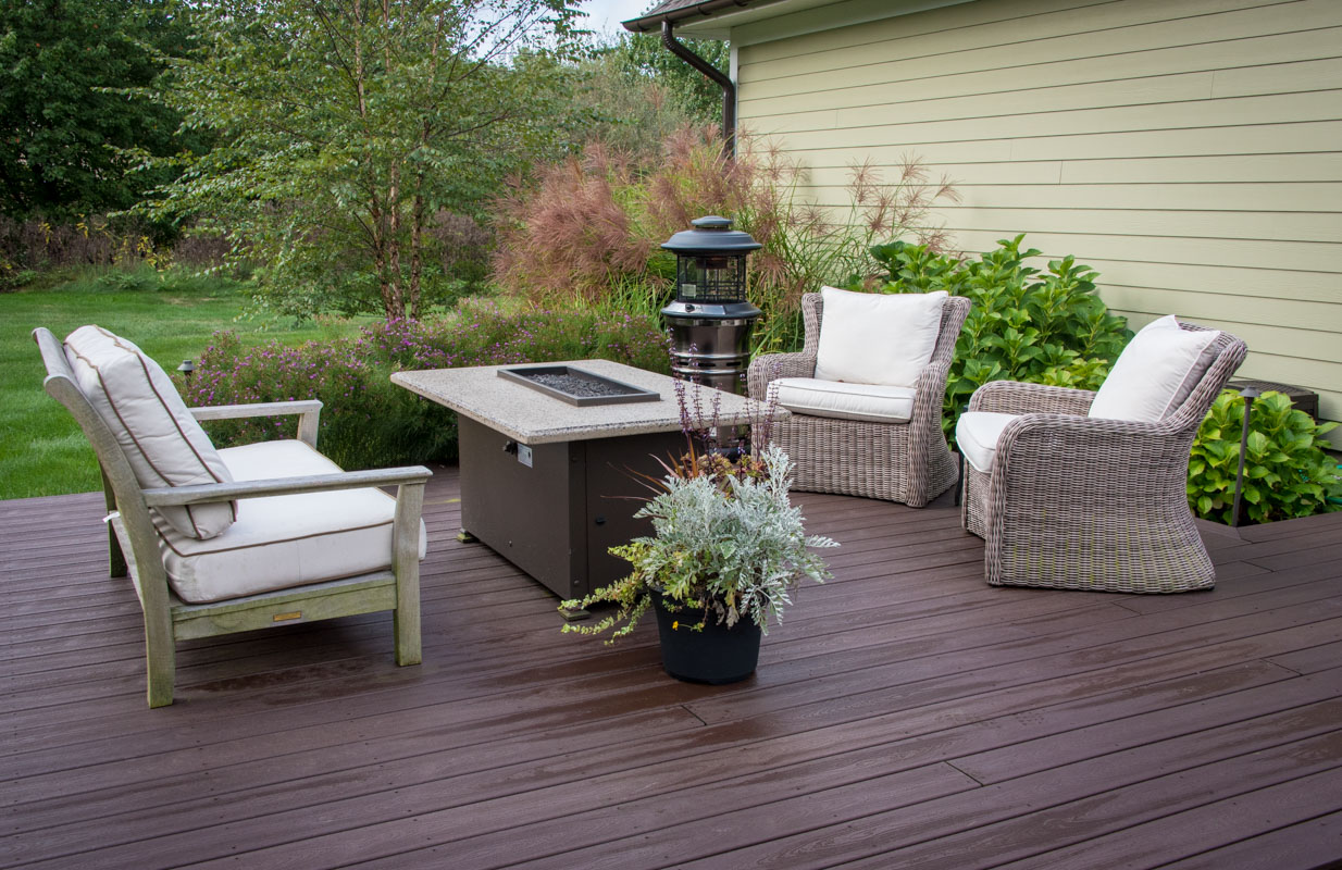 composite deck with fire table and furniture