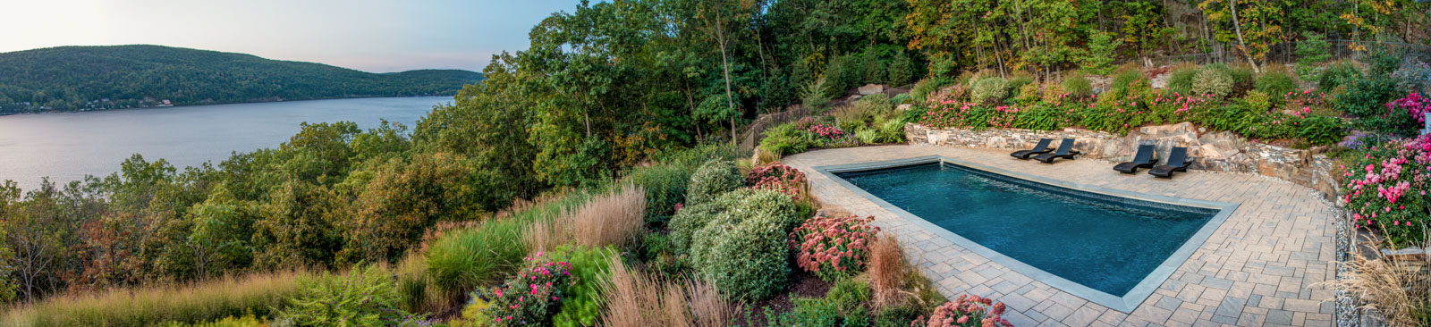heavily planted slope leading to pool area