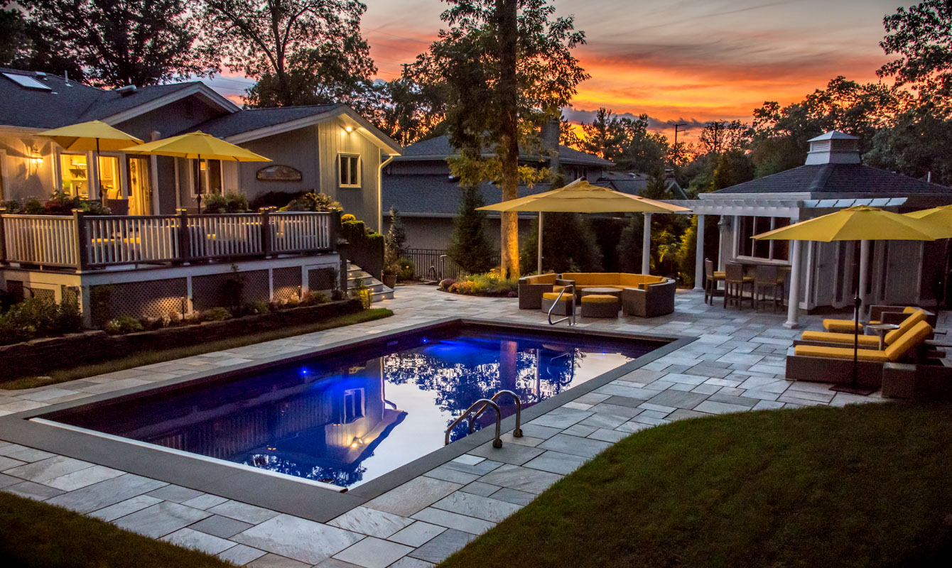 luxurious northern nj swimming pool design at sunset