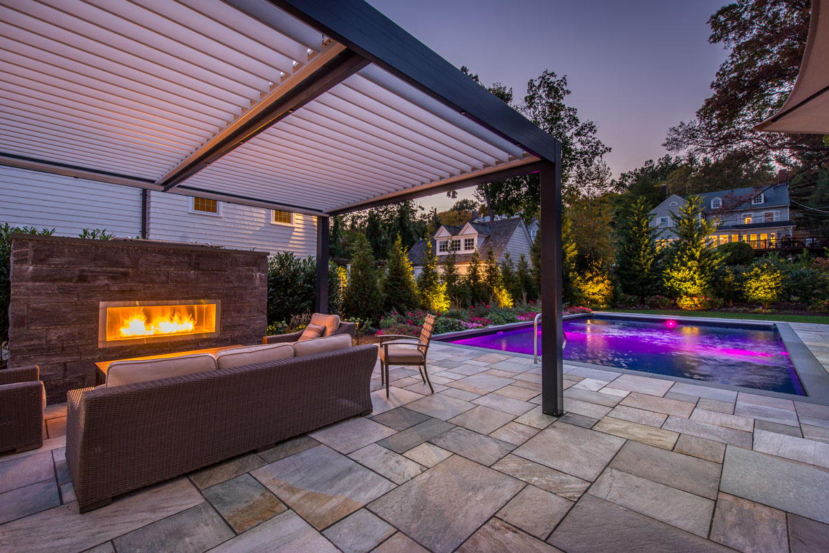 pergola with louvered roof, outdoor fireplace