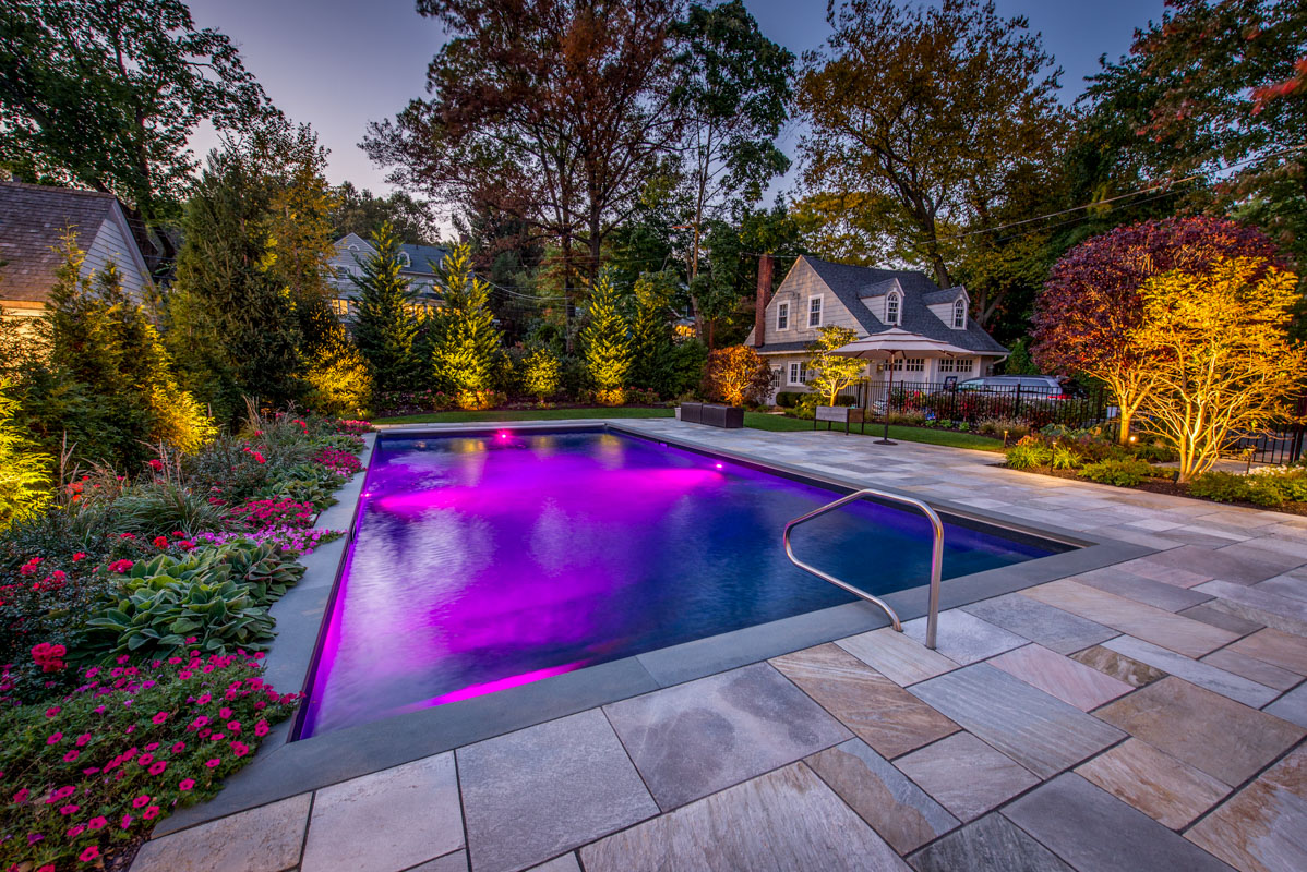 luxurious montclair nj backyard with landscape lighting and pool lighting