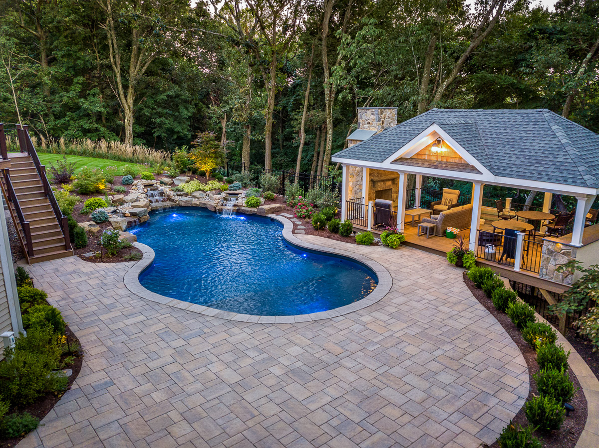 landscape design with pool, paver patio, pavilion