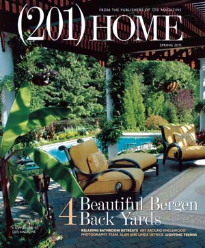Cover of (201) Home Magazine Spring 2011 featuring a luxurious backyard with a pergola-covered patio, elegant yellow cushioned chairs, and a lush garden view.