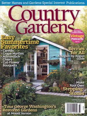 Cover of Country Gardens magazine featuring a charming turquoise garden shed surrounded by vibrant summer blooms and a winding stone path.