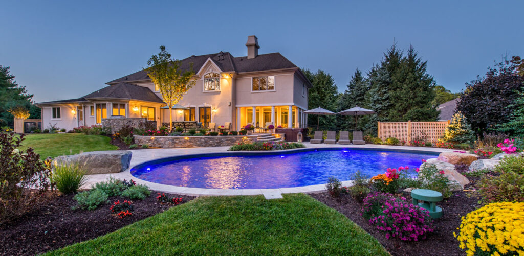 Hardscape paths, flexible seating, and feature planting form a lively yard.
