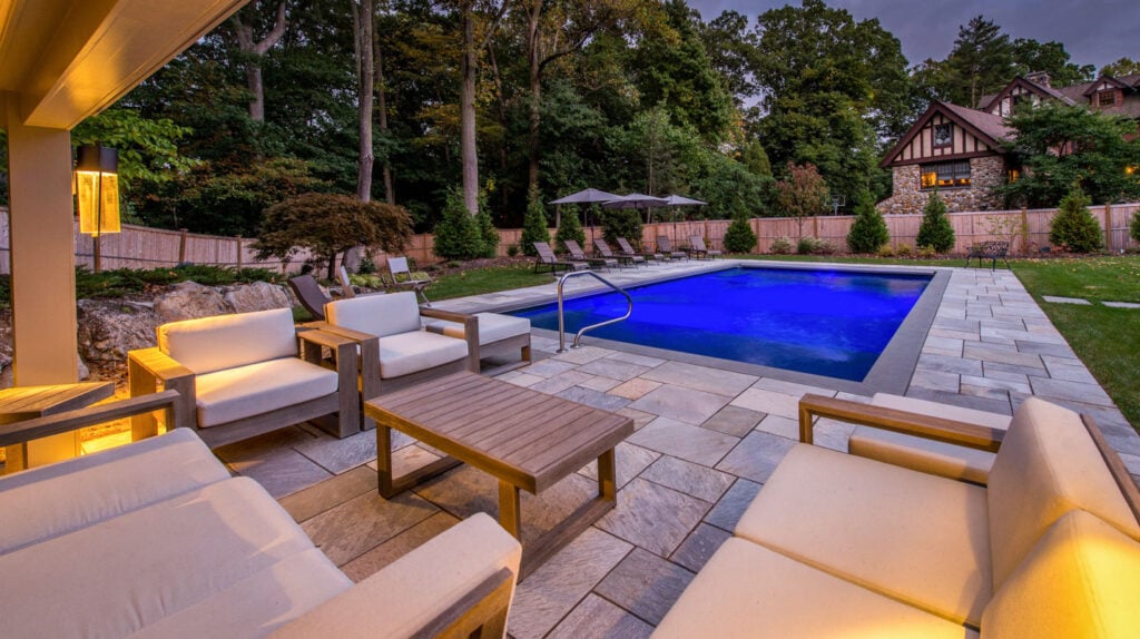 Sleek pool, inviting fire zone, and resort-worthy patio in one layout.