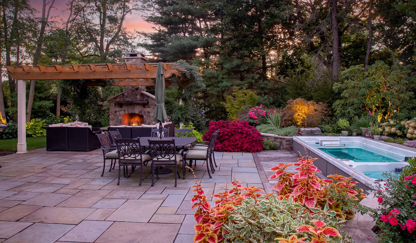 Vibrant Coleus and seasonal annuals in a curated backyard garden design by CLC Landscape Design in Franklin Lakes, NJ.