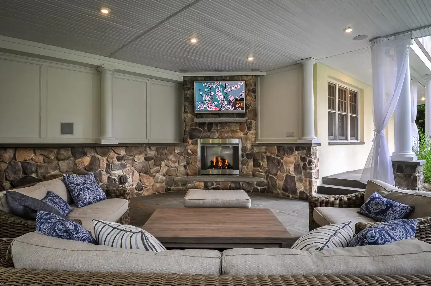 Luxury backyard pavilion fireplace installation NJ by CLC Design.