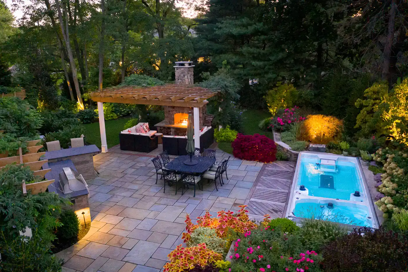 Modern stone outdoor fireplace NJ patio by CLC Landscape Design.