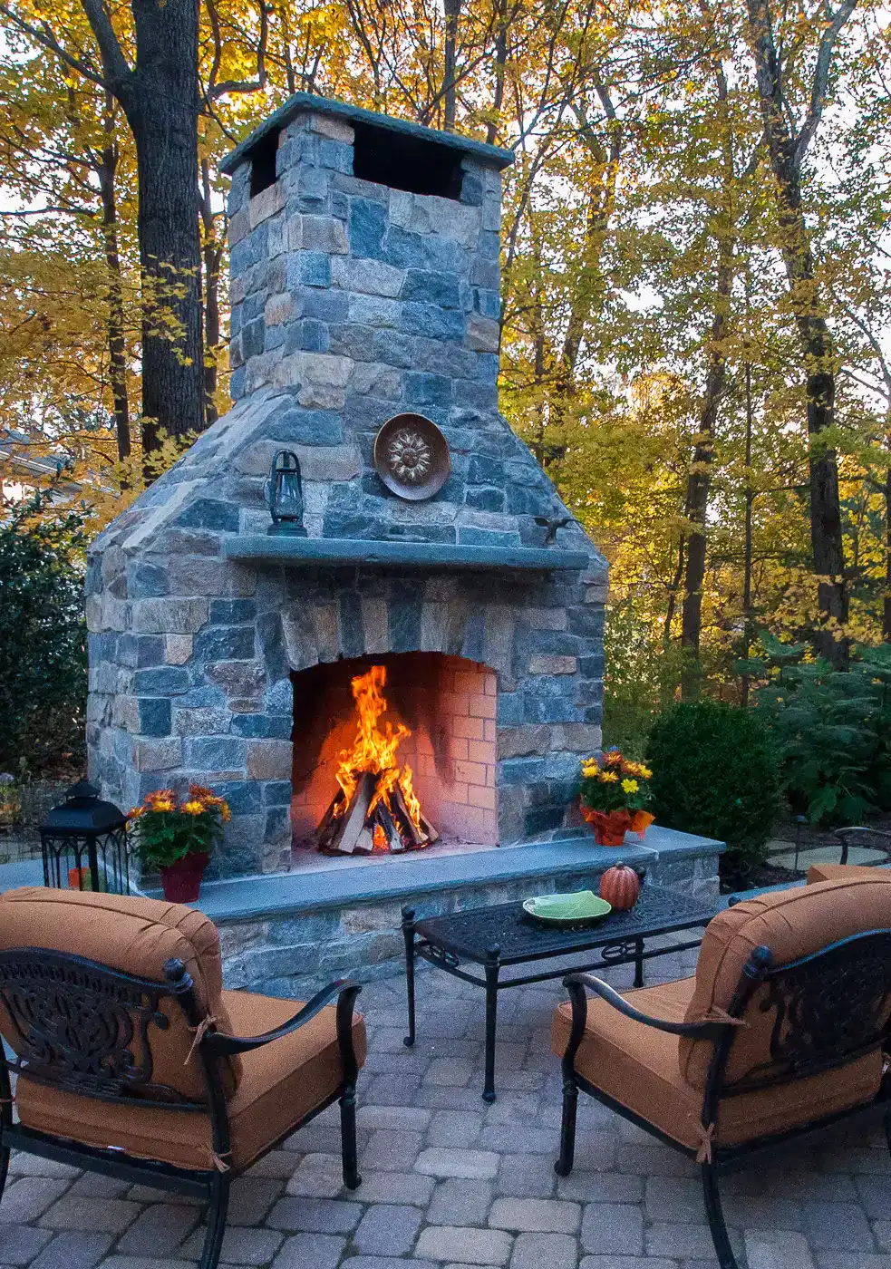 Stone outdoor fireplace flue feature by CLC Design NJ.