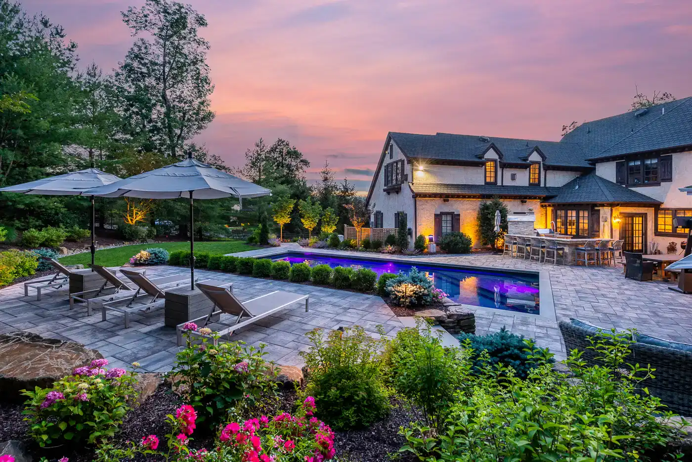 L-shaped outdoor kitchen for suburban NJ backyard by CLC Design.