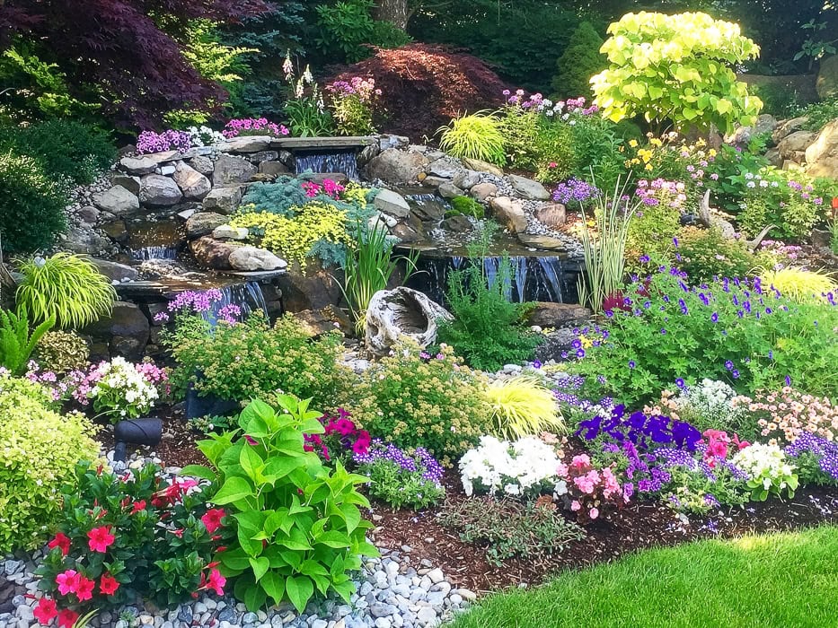Hidden gem landscape design in Montville New Jersey by CLC Landscape Design showcasing a tranquil outdoor space with rich greenery, layered plantings, and a natural garden retreat