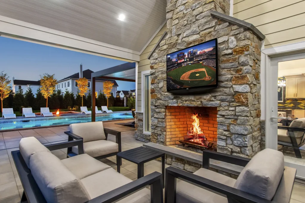 Backyard outdoor living space with pavilion and swimming pool by CLC Landscape Design NJ